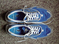Brooks Burn shoes, cushioned but no other support.  I use them for training and racing at all distances