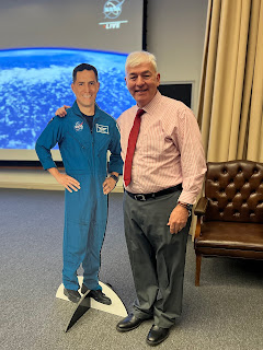 Dr. Joseph Lopreiato, director of USU's Val G. Hemming Simulation Center, grabs a quick photo with a cardboard cutout of Army Lt. Col. (Dr.) Frank Rubio, a USU grad who answered questions Nov. 21 from the International Space Station. (Photo credit: Sarah Marshall, USU)