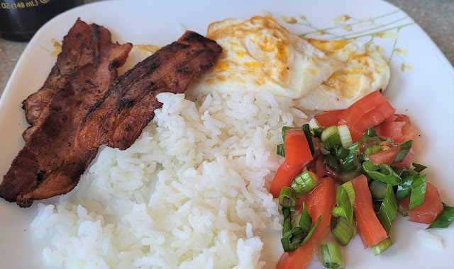 First Breakfast of 2021 bacon, eggs, rice, tomatoes and green onions