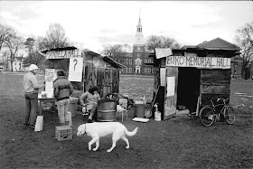 A black and white photograph of the campus shanty town.