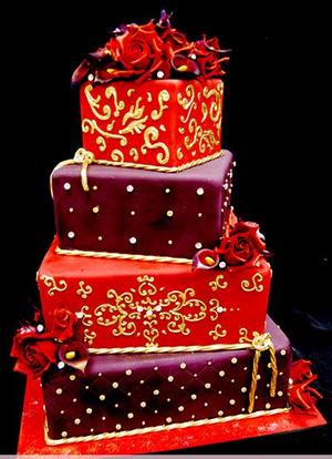 Square three tier white wedding cake with red damask pattern