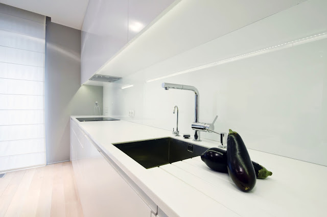 All White Cabinet and Countertop with Chrome Faucet
