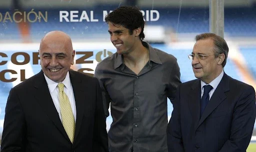 Kaká poses with AC Milan vice-president Adriano Galliani and Real Madrid president Florentino Pérez