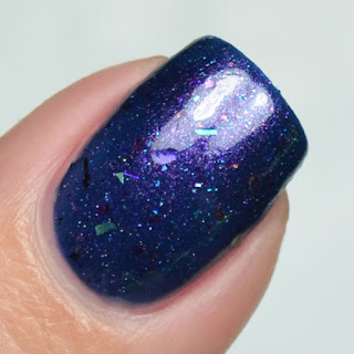 blue nail polish with shifting flakies and shimmer
