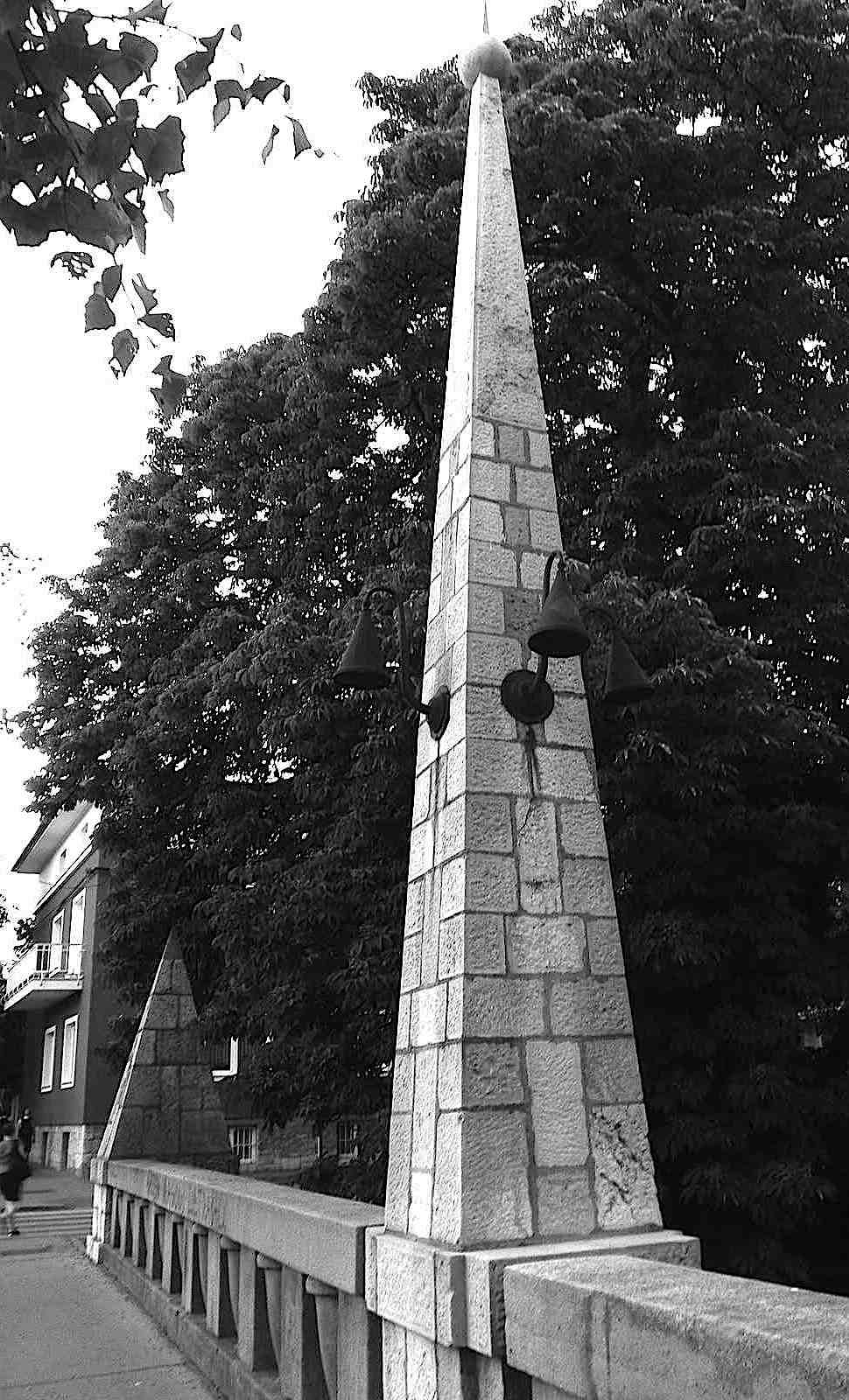 Jože Plečnik 1910s secession-style stone work pyramids on a bridge, a photograph