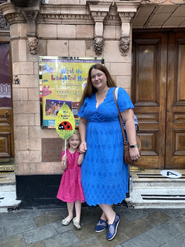 mum and daughter standing in front of palace theatre