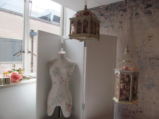 shabby chic display featuring bird cages and fabric manequin