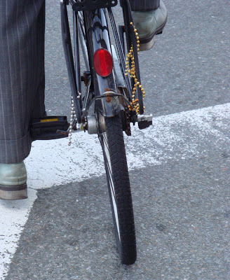 Mardi gras beads on a bike