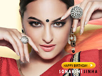 sonakshi sinha, gorgeous indian celeb in red saree and silver jewelry along diamond pearls with a big bindi