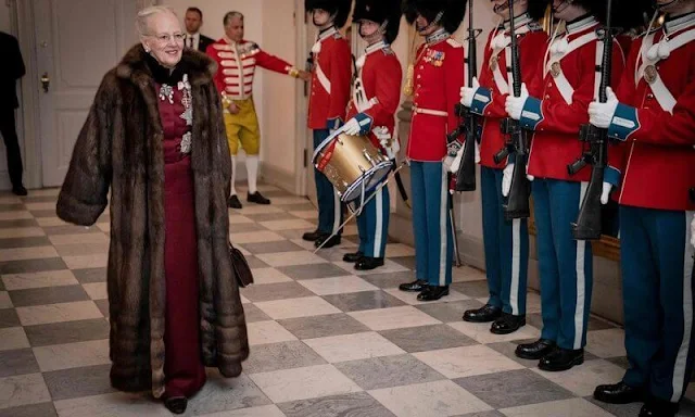 Princess Mary in bordeaux gown by Lasse Spangenberg. Queen Margrethe wore a bordeaux dress by Craftsmen's Association