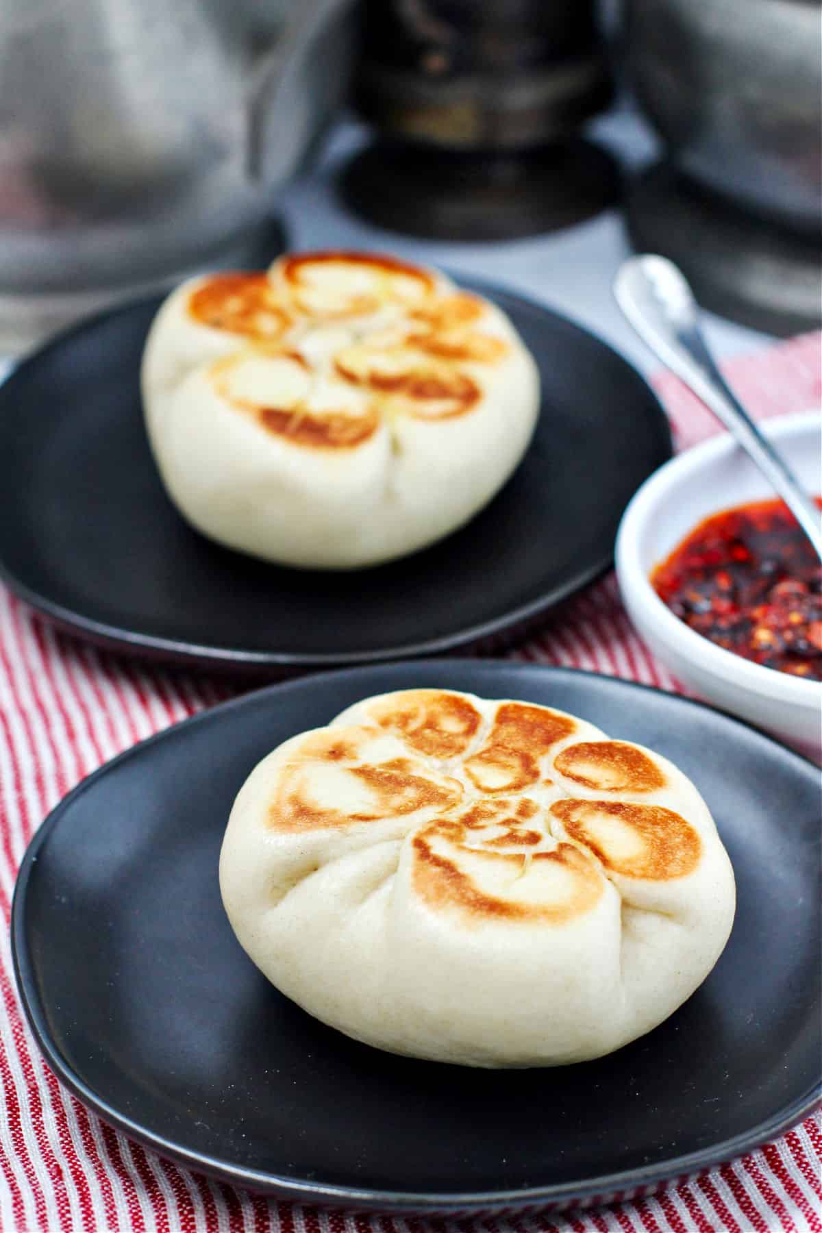 Steamed Chicken and Vegetable Buns on plates.