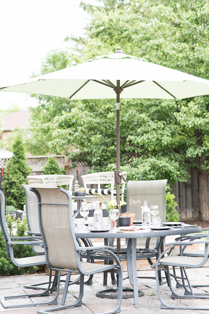 How to love your suburban backyard.  My tips for making the most of your space and living in it throughout the summer. Set up a table with shade.