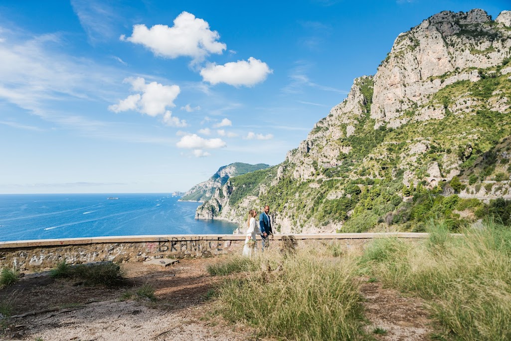 Bride and groom with Amalfi coast view