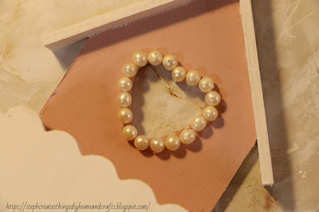 Closeup of heart design with faux pearls