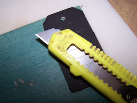 use an exacto knife to make a tag from a book