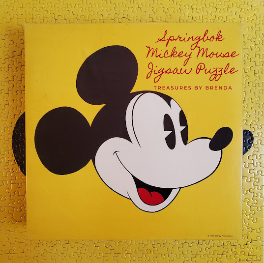 Springbok's vintage Mickey Mouse puzzle, showing Mickey's head using just four colors, is a challenging but fun puzzle for avid puzzle and Disney enthusiasts. Learn more here.