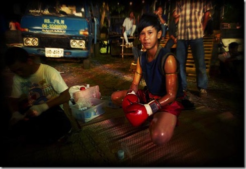 Thailand, Isan region, Buriram, Wat Sarbua Buddhist temple festival, Muay Thai kick boxing in temple, Lo Ma young girl boxer