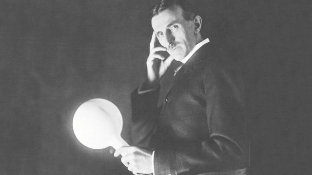 Tesla photographed with a lightbulb.
