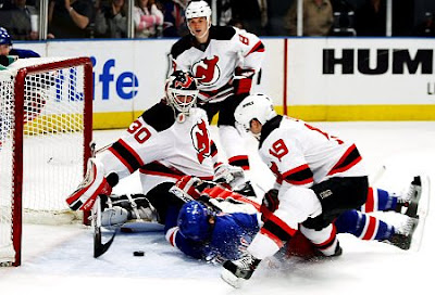 Nigel Dawes scores the winning goal on Thursday as he follows the puck into the net.