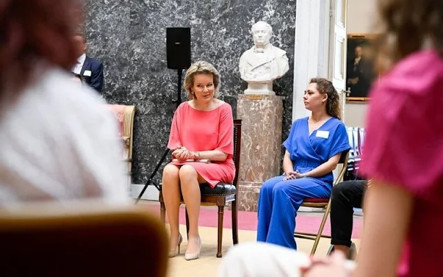 Queen Mathilde wore a fuchsia silk cape dress by Natan. Christine Bekaert gold flower bracelet, diamond drop earrings