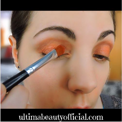 Ultima Beauty applying Take Me to Church to eyelid