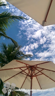 beach umbrellas blue sky