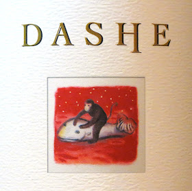 Wine label depicticting a monkey riding a whale.