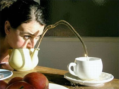 An unusual way to pour water to a cup of tea