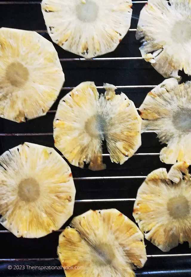 Drying pineapple slices on wire rack