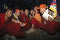 Tibetan monks listen to RFA