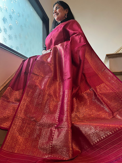 Radiant Elegance: Exploring the Pink Checkered Silk Kanjivaram Saree with a Broad Skirt Border