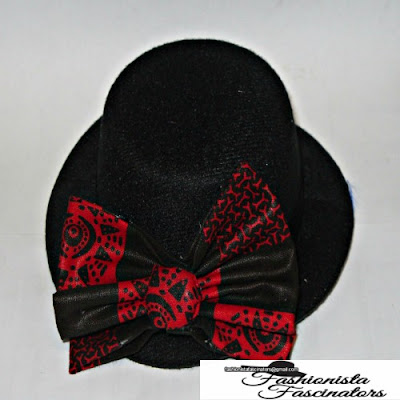 black fascinator hat with a black and red African print bow tie Nairobi Kenya