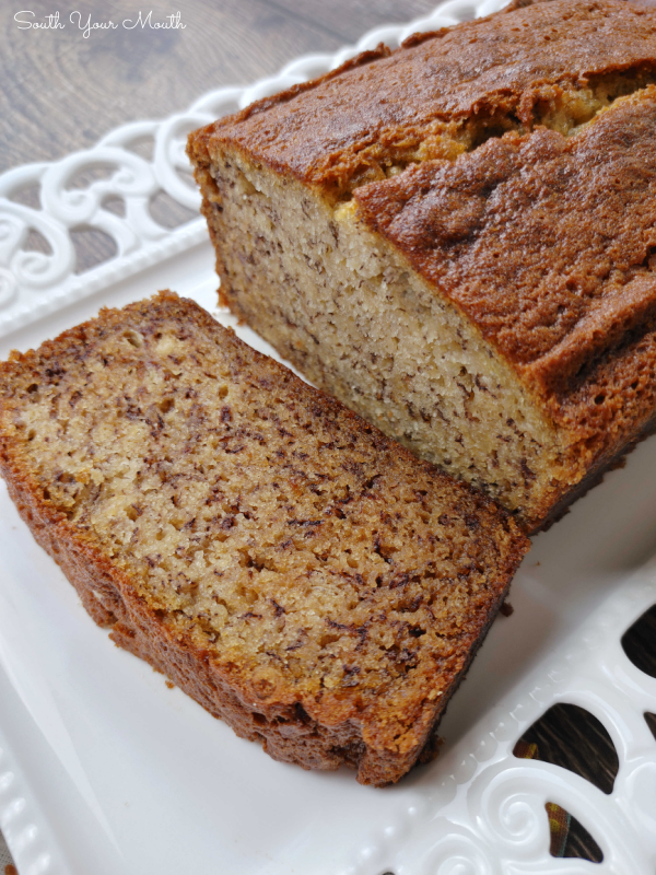 Secret Ingredient SUPER MOIST Banana Bread! The BEST banana bread recipe made incredibly moist by adding a secret ingredient! It may seem odd but once you’ve made it this way, you’ll never make it without it again!