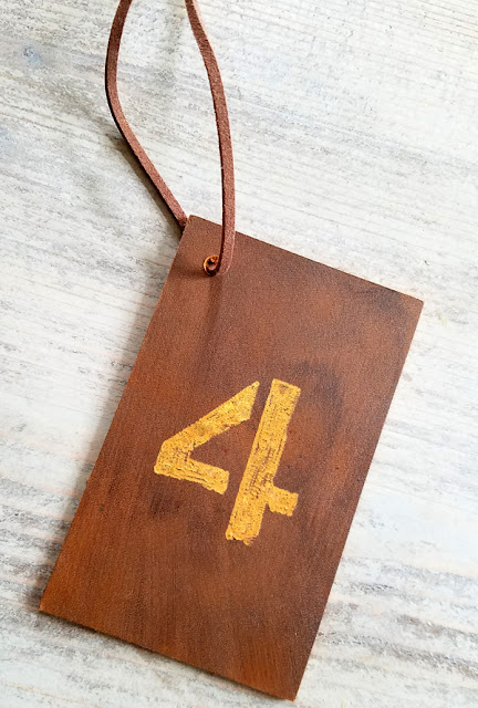 number four engraved on a piece of leather with a Dremel 4300 tool