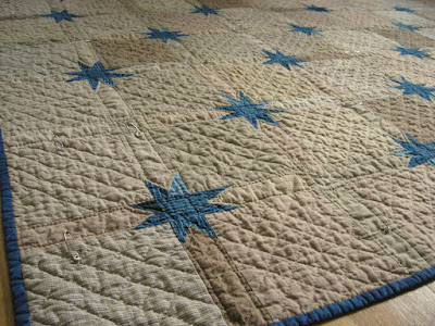 Scrappy quilt with Uneven Stars or Morning Stars or stars in the sashing