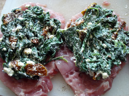 top pork chops with feta and spinach mix