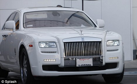  coordinated Kim's Rolls Royce even ties in with the white Chanel logo