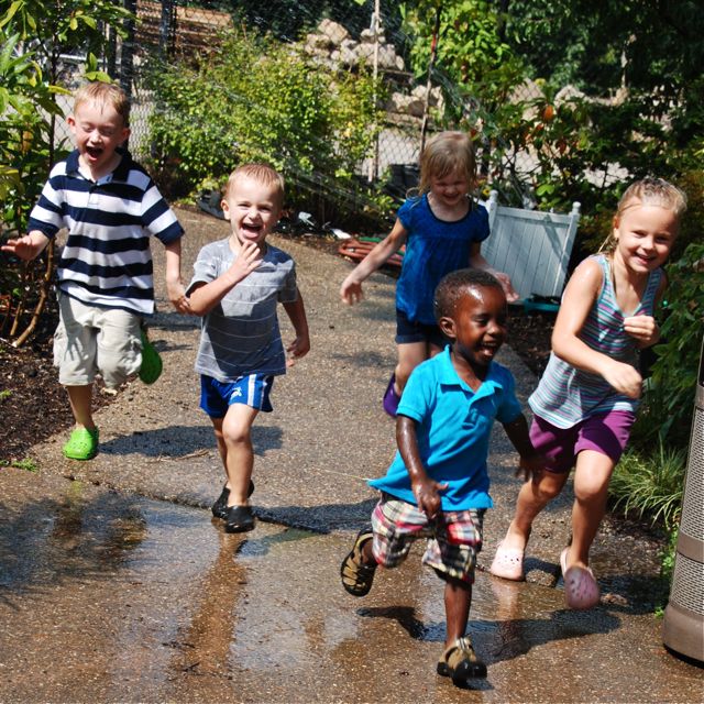 The kids happen to find a sprinkler in the outdoor garden over the sidewalk a bit. Such delinquent fun!