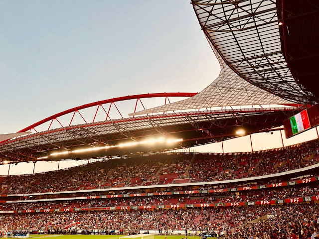 Stadium filled with fans watching football