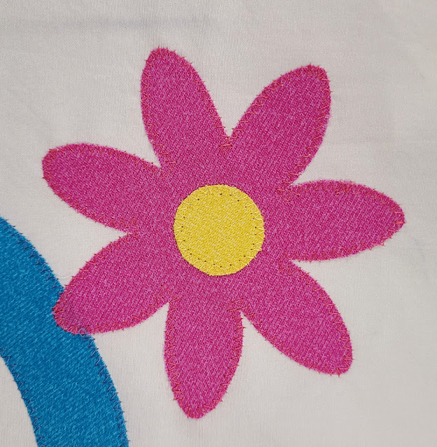 Applique flower with zig zag stitching | DevotedQuilter.com