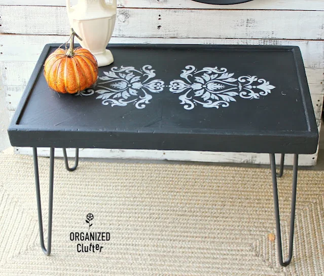 Photo of coffee table upcycled with paint and damask stencil