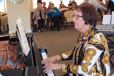 Mary Elvin playing the grand piano. Photo courtesy of Dennis Lyons.