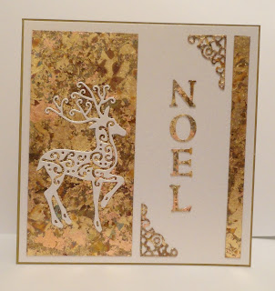 Gold gilded Christmas card with reindeer and Noel