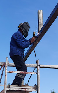 Sally welding an upright