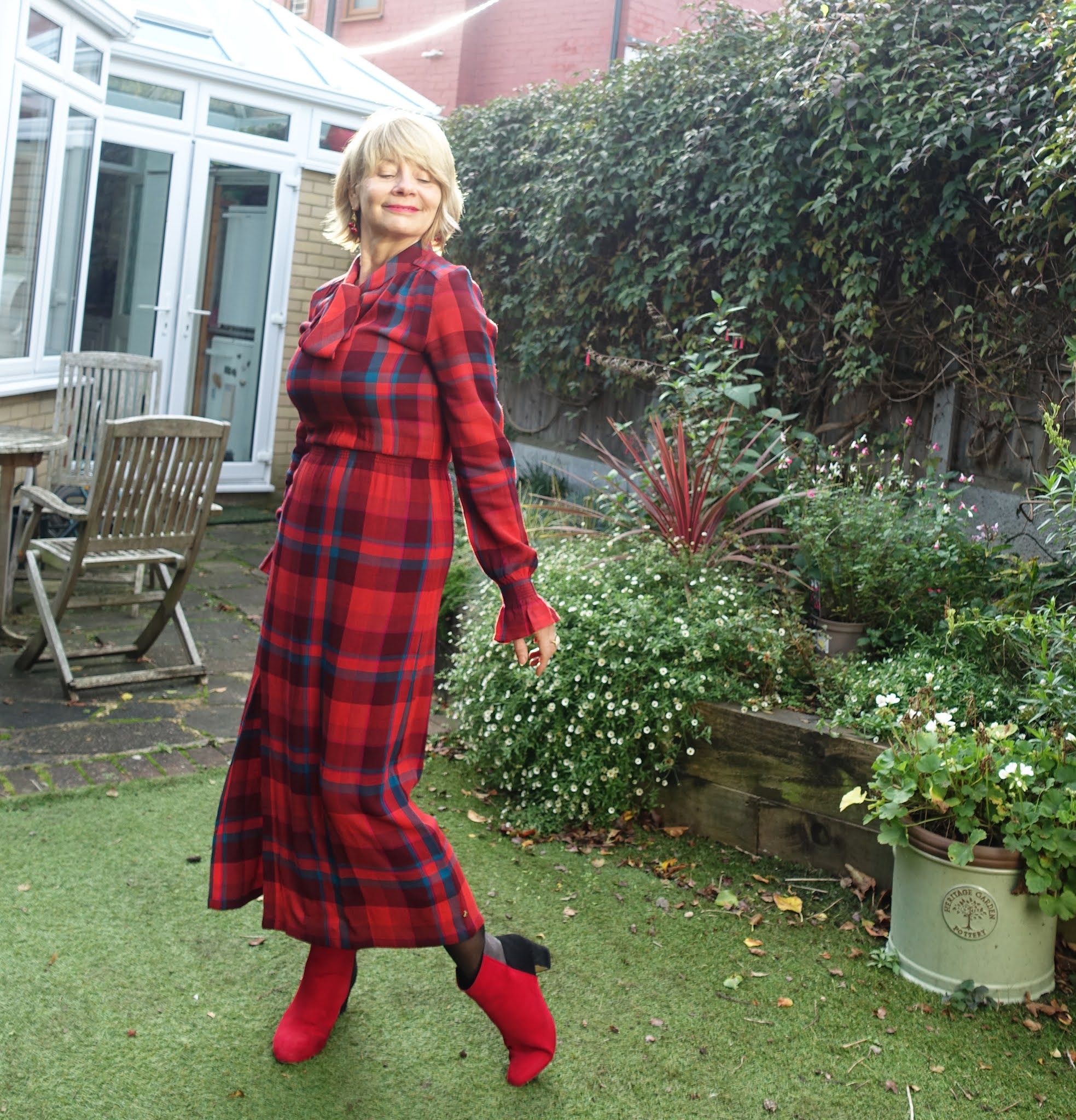 A red plaid dress with red and black boots worn by Is This Mutton style blogger Gail Hanlon