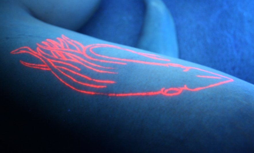 Nice Squid Blacklight Tattoo. I wonder what it looks like without the 