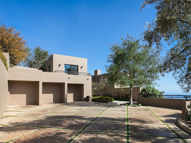 Photo of garage entrances as seen from the driveway