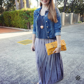 awayfromtheblue instagram layering maxi dress with a tee and denim jacket, yellow Balenciaga clutch
