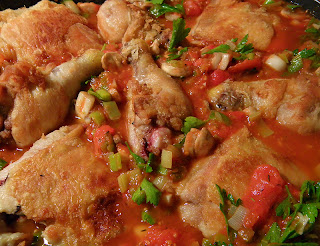 Chicken and Sauce in Pan Simmering