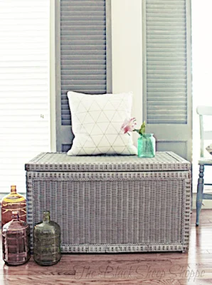 Painted wicker storage bench.